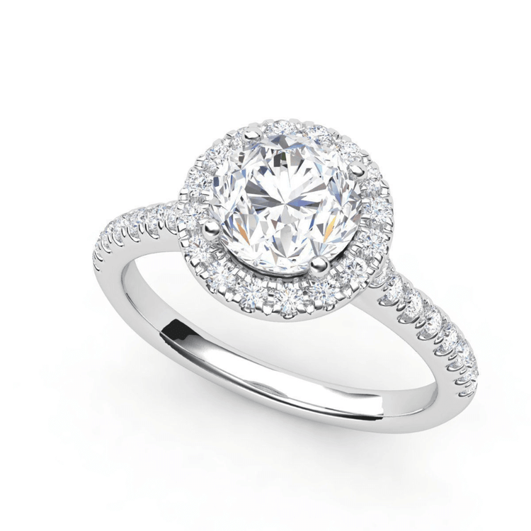 The 14k Round Lab Diamond Halo Setting Engagement Ring features a brilliant round center diamond in a halo setting, accented by smaller diamonds along the band—an elegant choice for those seeking sophisticated gold engagement rings.