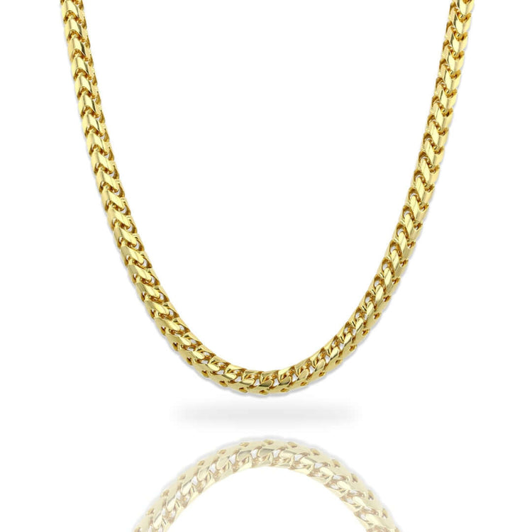 The Franco Chain - 3mm-3.5mm 14k Gold Bonded is displayed on a white background with a subtle reflection, perfect for those seeking a bold, polished look similar to classic curb link gold chains.