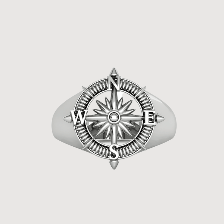 The 14k Gold Compass Ring - Nautical Star Navigator Design features a detailed compass rose and raised N, S, E, W letters on the face. With a smooth polished band, this men’s ring makes a bold nautical statement.