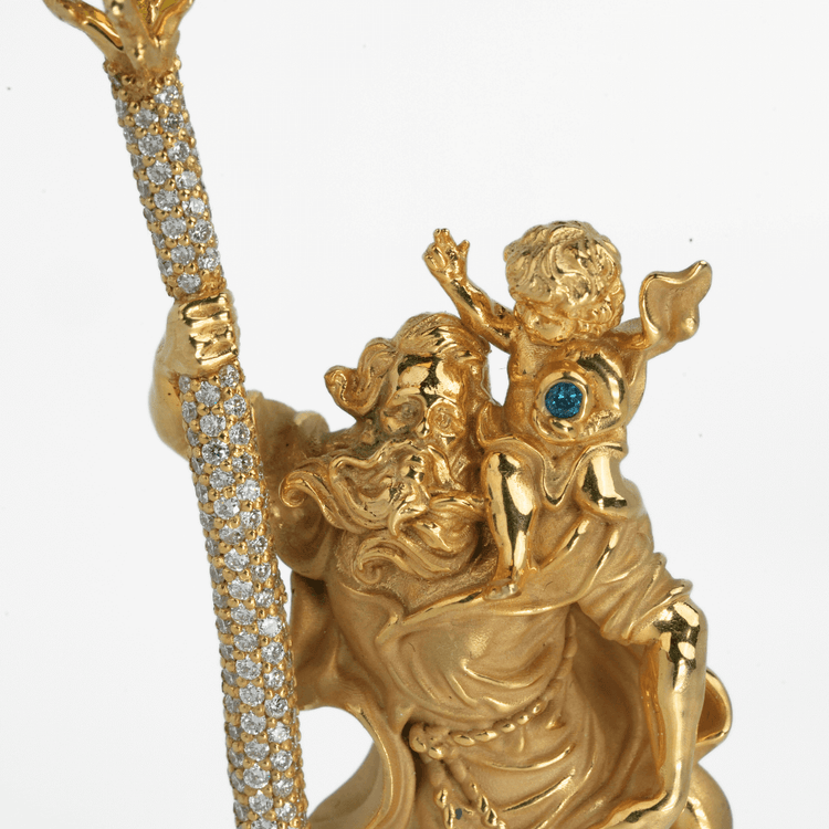 The Saint Christopher Pendant - 14k Gold features a detailed depiction of a bearded man with a staff, carrying a child on his shoulder; both figures face away from the viewer and are accented with sparkling gems.