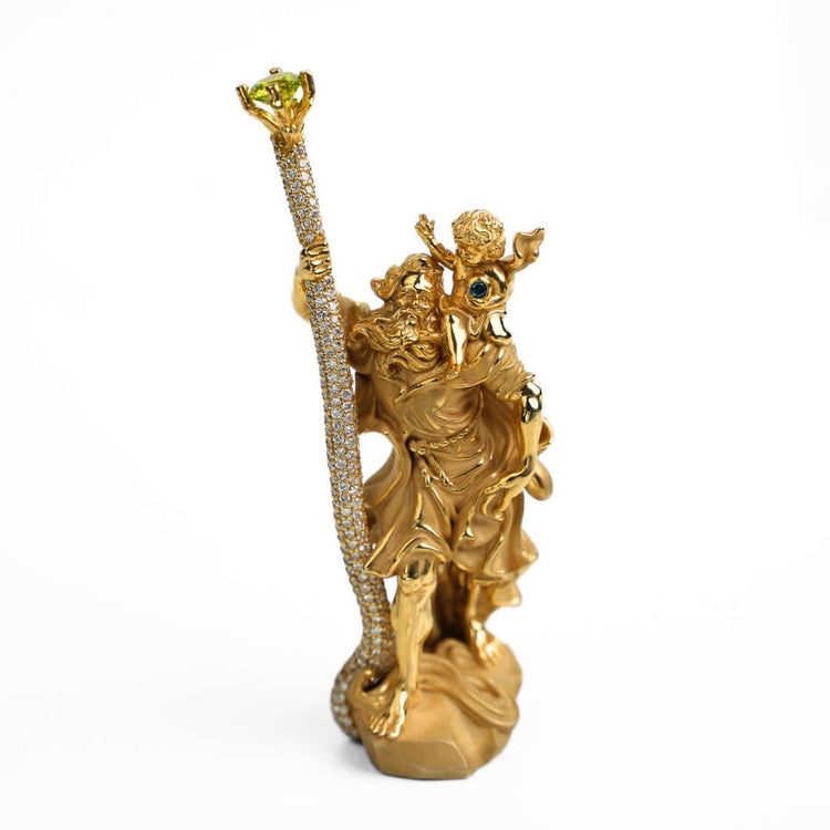 A 14k gold Saint Christopher Pendant features a bearded man carrying a child on his shoulder, holding a jeweled staff, displayed against a plain white background.