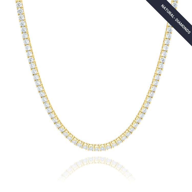 The Tennis Chain – 14K Gold Natural Diamond showcases a continuous row of round, sparkling white diamonds. A small label at the top right corner indicates "NATURAL DIAMONDS.