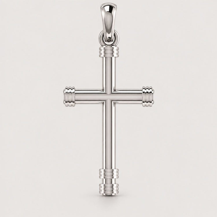 A 14k gold cylindrical cross pendant with rounded edges and decorative bands at the ends, suspended from a loop against a plain light background.
