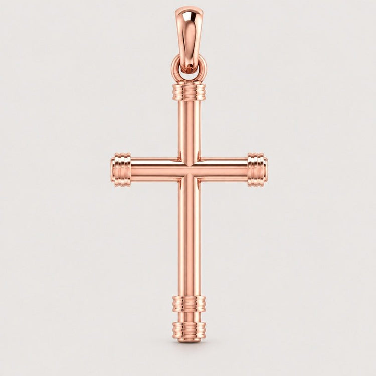 Showcased on a light background, the 14k Gold Cylindrical Cross Pendant features a rose gold finish with a sleek, polished design and eye-catching decorative accents at each end. This elegant pendant seamlessly combines sophistication with classic style.
