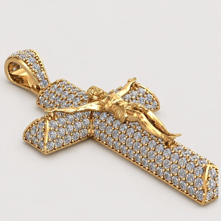Introducing the 14K Gold Diamond Crucifix Pendant—a beautiful piece crafted in 14K gold, encrusted with sparkling diamonds and featuring a finely detailed gold figure of Jesus Christ on the cross, displayed against a simple light background.
