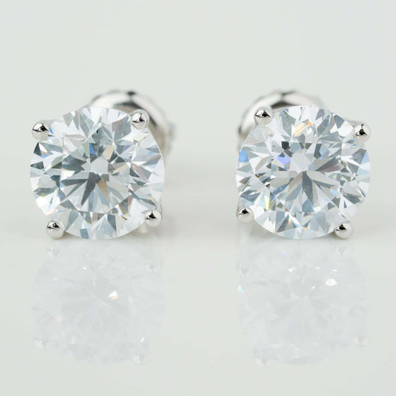 14k Classic Round Lab Diamond Four Prong Stud Earrings (F/G VS+)Discover elegance with our 14K White Gold Classic Round Diamond Stud Earrings. Featuring F/G color and VS+ clarity diamonds in a secure prong setting.