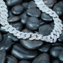  Shop 14mm Iced-Out Cuban Link Chain. Featuring 3 rows of Certified Moissanite Diamond Stimulants set in 925 Sterling Silver and Rhodium Plated. 