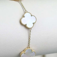  White Four Leaf Clover Bracelet - 14k Yellow Gold Delicate 14k yellow gold bracelet with white four leaf clovers. A symbol of luck and elegant style. Shop this beautiful piece for yourself or as a meaningful gift!