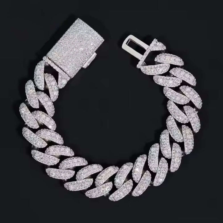 The Silver Moissanite Cuban Link Bracelet - 16mm is a thick 925 sterling silver piece, encrusted with sparkling moissanite stones and shown in a circular shape on a black background.