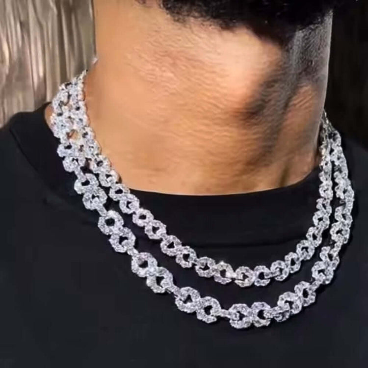 A person wears two shining Silver Moissanite Infinity Necklaces (16mm, 925 sterling silver) over a black shirt. The sparkling round links catch the light, making the luminous jewelry stand out around their neck.