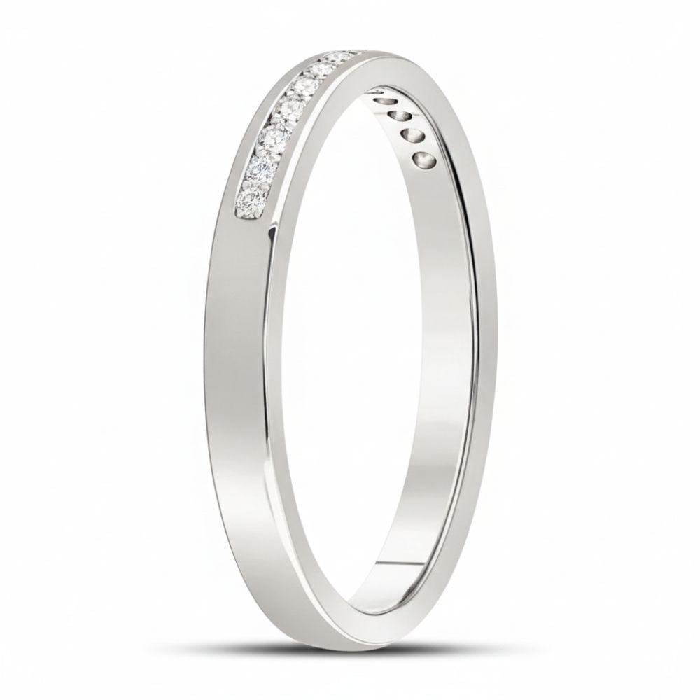 The 14k White Gold Channel-Set Diamond Wedding Band 1/10 Cttw features a slim, polished white gold band with a single row of round diamonds in a linear channel setting, displayed on a plain white background.