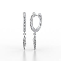 The 10k White Gold Diamond Drop Dangle Earrings feature small round diamonds and dangling marquise-shaped charms encrusted with diamonds, shown elegantly against a white background.