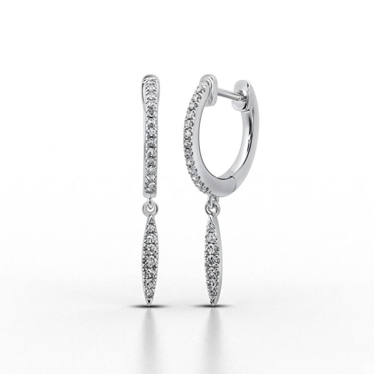 The 10k White Gold Diamond Drop Dangle Earrings feature small round diamonds and dangling marquise-shaped charms encrusted with diamonds, shown elegantly against a white background.