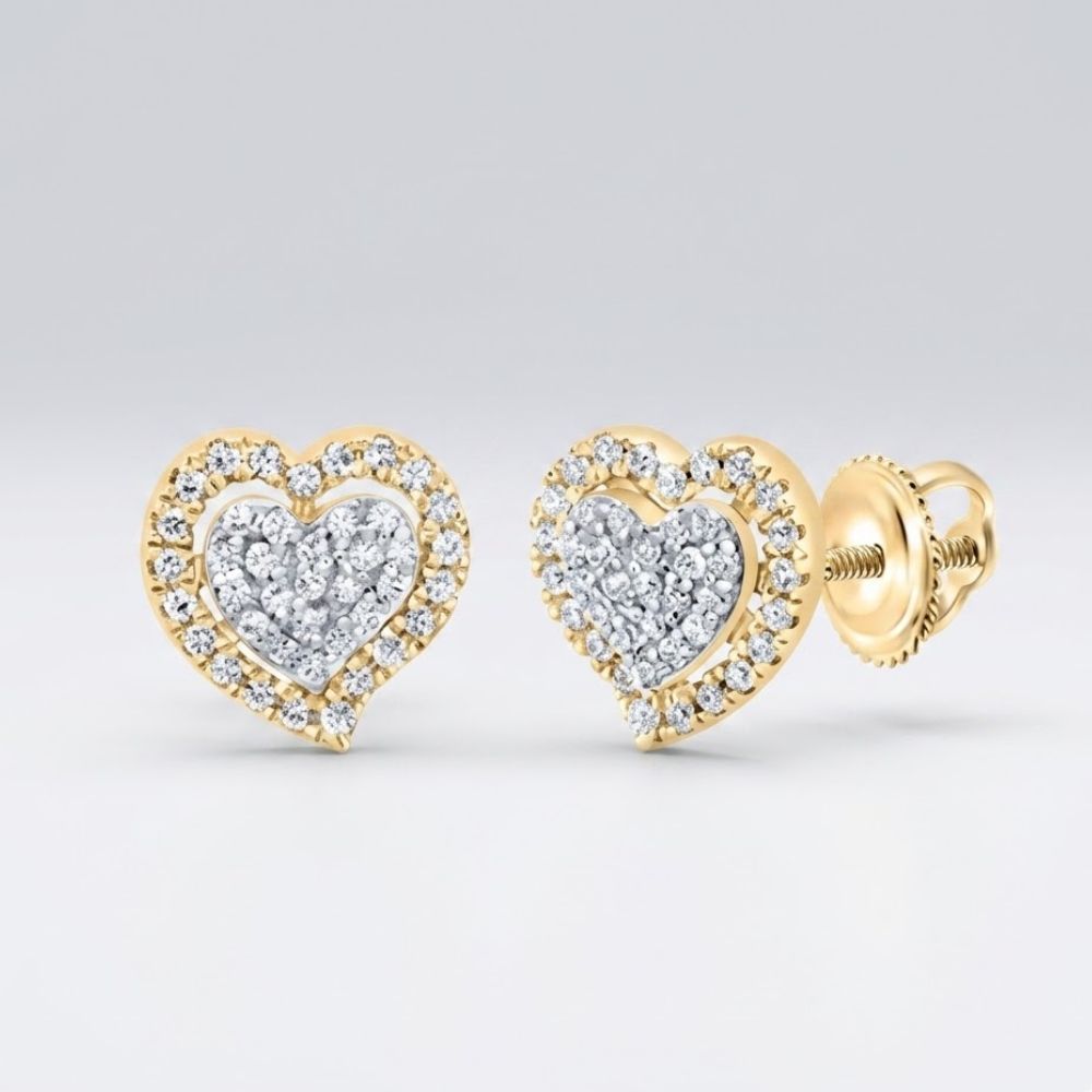 The 1/5CTW Diamond Gift Heart Earrings in 10K gold feature sparkling diamonds at the center and along the edges of heart-shaped studs, beautifully displayed on a plain light background.