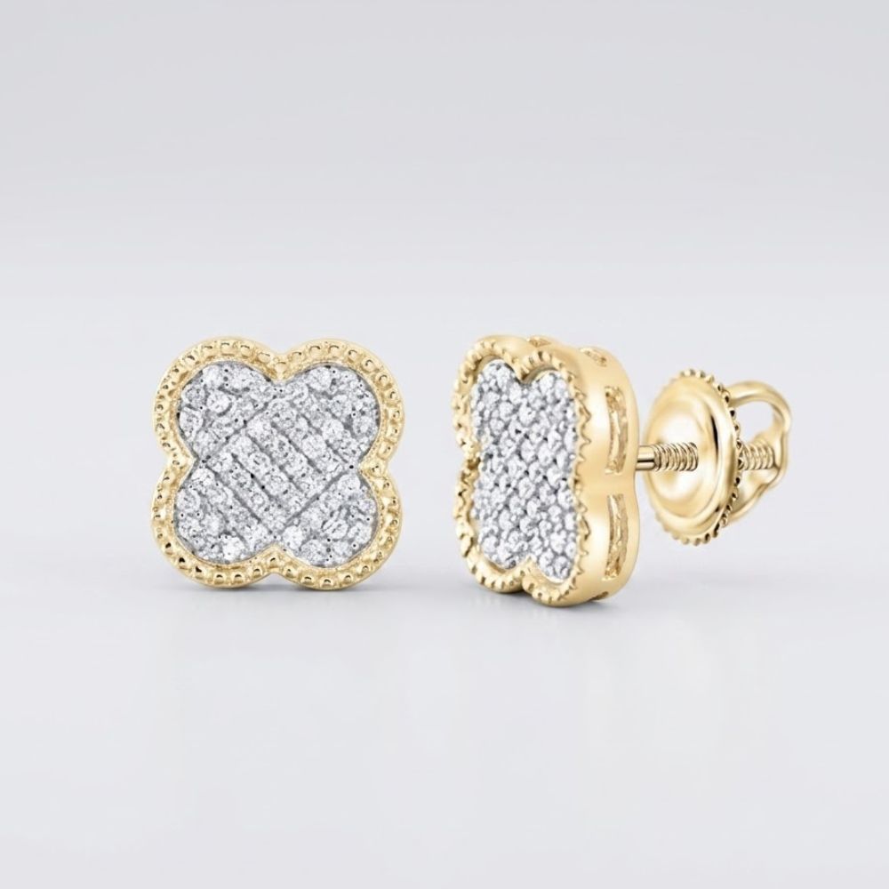 The 1/5CTW Diamond Clover Earrings in 10K gold, designed as four-leaf clovers with sparkling white stones, are displayed on a light gray surface—an elegant gift choice.