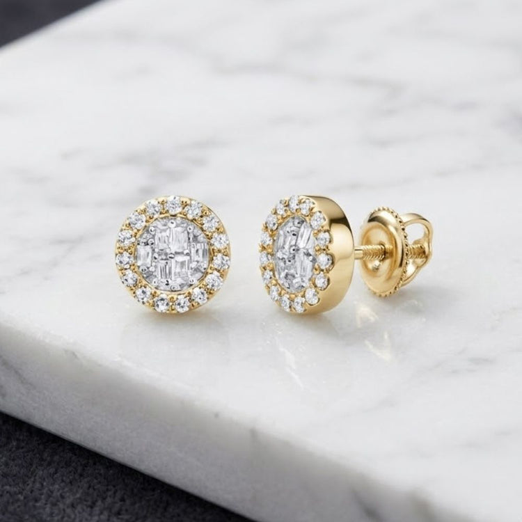 1/5CTW Diamond Earrings 10K featuring round and baguette diamonds set in round, diamond-encrusted centers and halos. Displayed on a white marble surface, one earring lies flat while the other stands upright to reveal the secure screw-back closure—an elegant showcase of natural diamond earrings crafted in 10k gold.