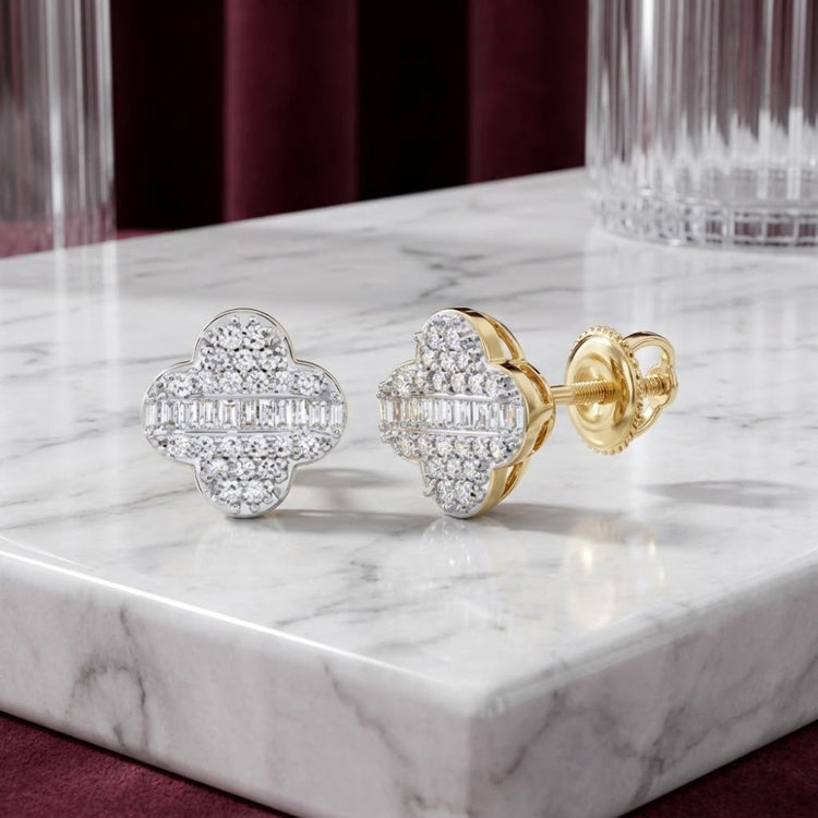 Elevate your style with the 1/4 CTW Natural Diamond Clover Earrings in 10K Gold—delicately arranged on a marble surface, these earrings dazzle with sparkling natural diamonds in a refined clover design, set against a faceted glass and burgundy velvet backdrop.