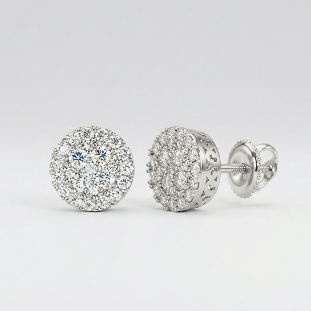 The 10k Gold Diamond Cluster Earrings 5/8 Cttw feature round diamonds in intricate silver settings, shown from the front to highlight their sparkle and from the side to display the detailed design and secure screw-back post.
