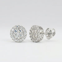 The 10k Gold Diamond Cluster Earrings 5/8 Cttw feature round diamonds in intricate silver settings, shown from the front to highlight their sparkle and from the side to display the detailed design and secure screw-back post.