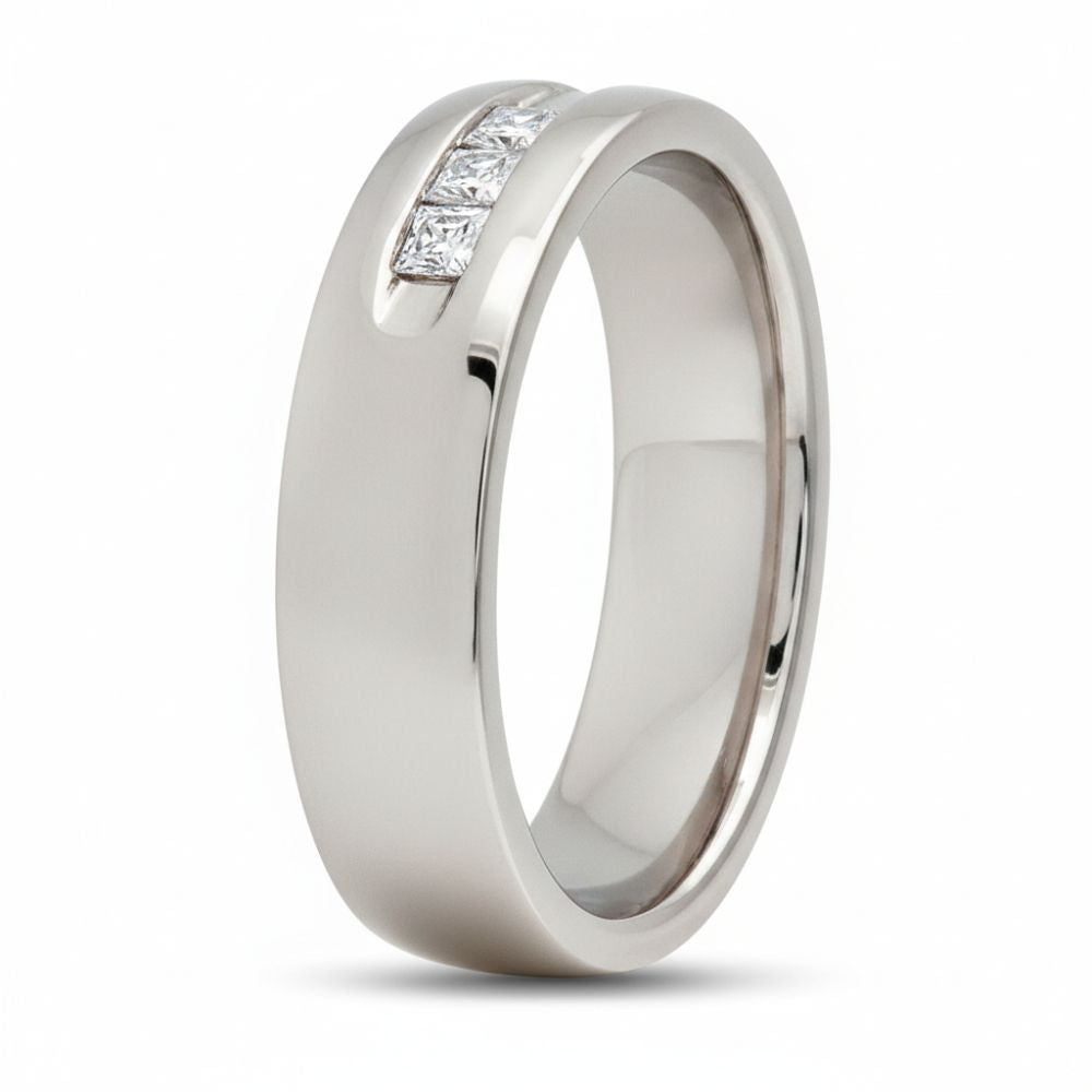 The 14k White Gold Princess Diamond Wedding Band 1/2 Cttw features a smooth, polished band set with three square-cut princess diamonds in a groove, all showcased against a plain white background.