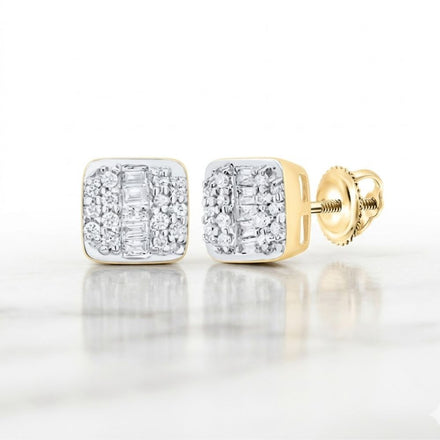 The 10k Gold Cushion Diamond Earrings 1/4 Cttw feature sparkling round and baguette-cut diamonds set in gold, showcased on a white marble surface.