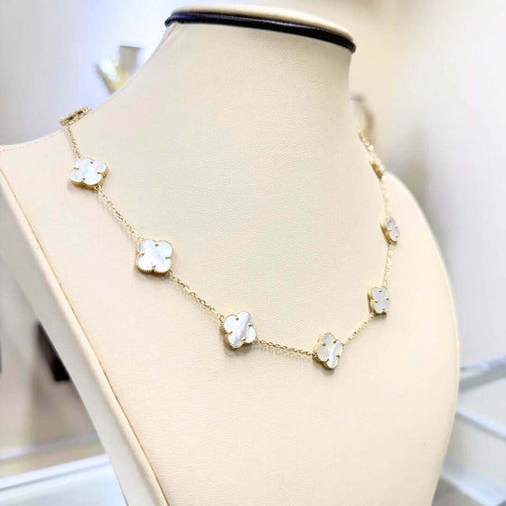 White Four Leaf Clover Necklace - 14k Yellow Gold Elegant 14k yellow gold necklace with a luminous white four leaf clover pendant. A symbol of luck and delicate beauty. Shop the White Clover Necklace today!