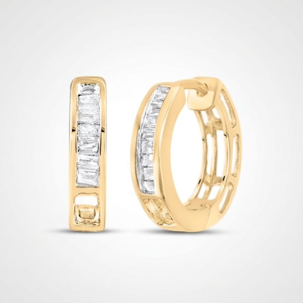 A pair of 14k Gold Baguette Diamond Huggie Hoop Earrings (1/6 cttw) featuring a row of rectangular-cut diamonds in front, shown against a plain white background.