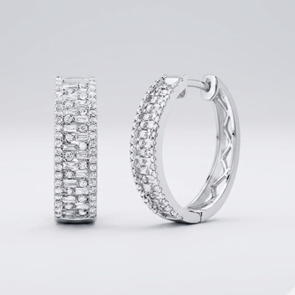 The 14k Gold Baguette Diamond Hoop Earrings 7/8CTW feature multiple rows of sparkling diamonds and are displayed on a plain light gray background.