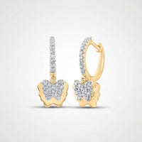 The 10k Gold Diamond Butterfly Hoop Earrings 1/4 Cttw feature sparkling diamonds and delicate butterfly designs, showcased elegantly against a light gray background.