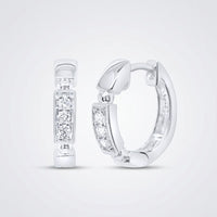 A pair of 10k gold diamond fashion hoop earrings (1/10CTW) featuring sparkling white gemstones in rectangular settings, shown on a light gray background.