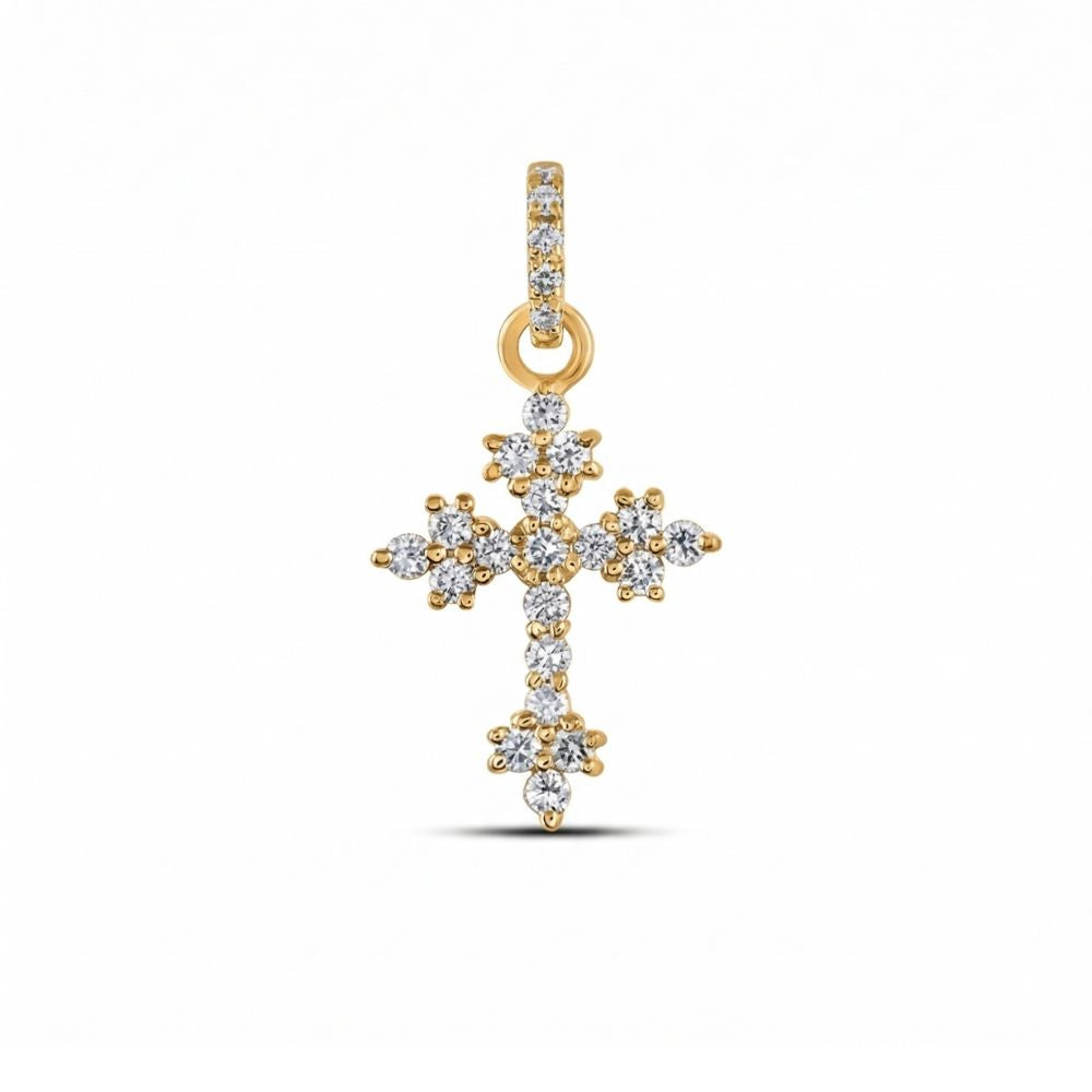 The 1/6CTW Diamond Cross Pendant in 14K yellow and white gold features multiple natural diamonds and a diamond-studded bail, beautifully displayed against a plain white background.