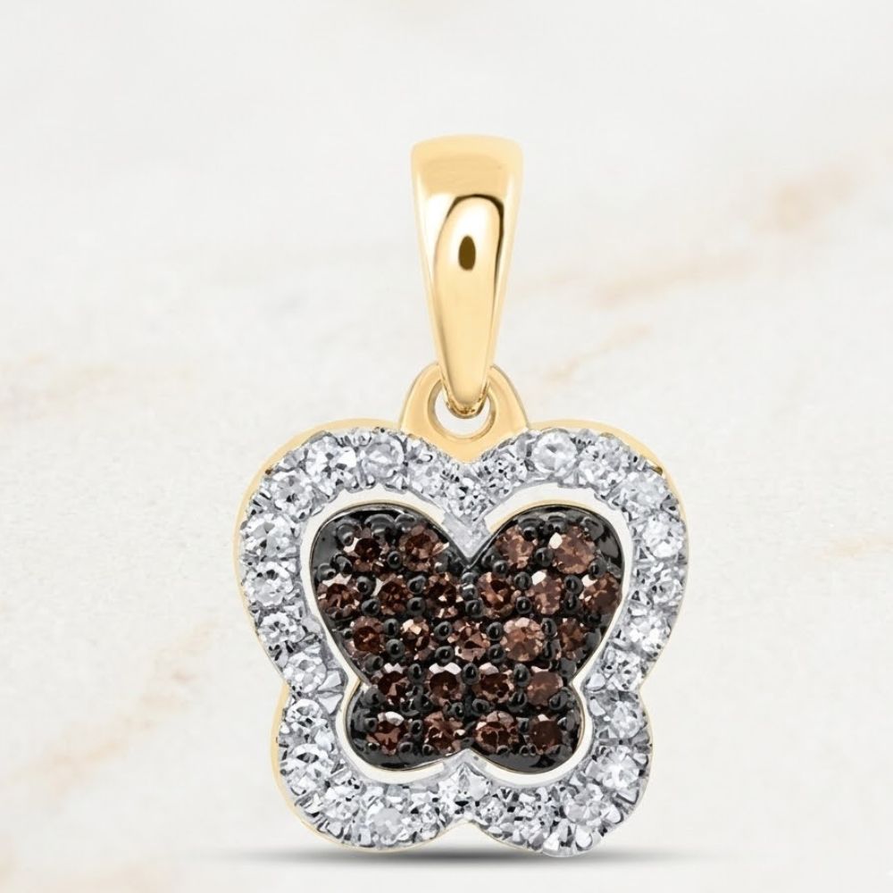 The 1/5CTW-DIA P1 Gift Cognac Natural Diamond Butterfly Pendant features a 10k gold design with cognac diamonds at the center and clear gems along the border for a dazzling look.