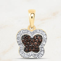 The 1/5CTW-DIA P1 Gift Cognac Natural Diamond Butterfly Pendant features a 10k gold design with cognac diamonds at the center and clear gems along the border for a dazzling look.