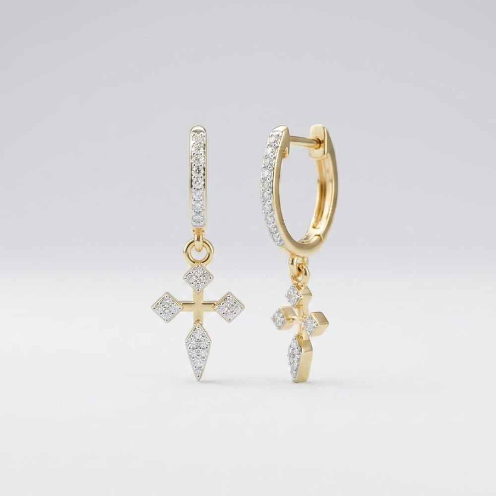 The 10k Gold Diamond Cross Hoop Dangle Earrings 1/6 Cttw feature hoop designs with cross-shaped charms, each encrusted with sparkling diamonds, shown against a plain light background.