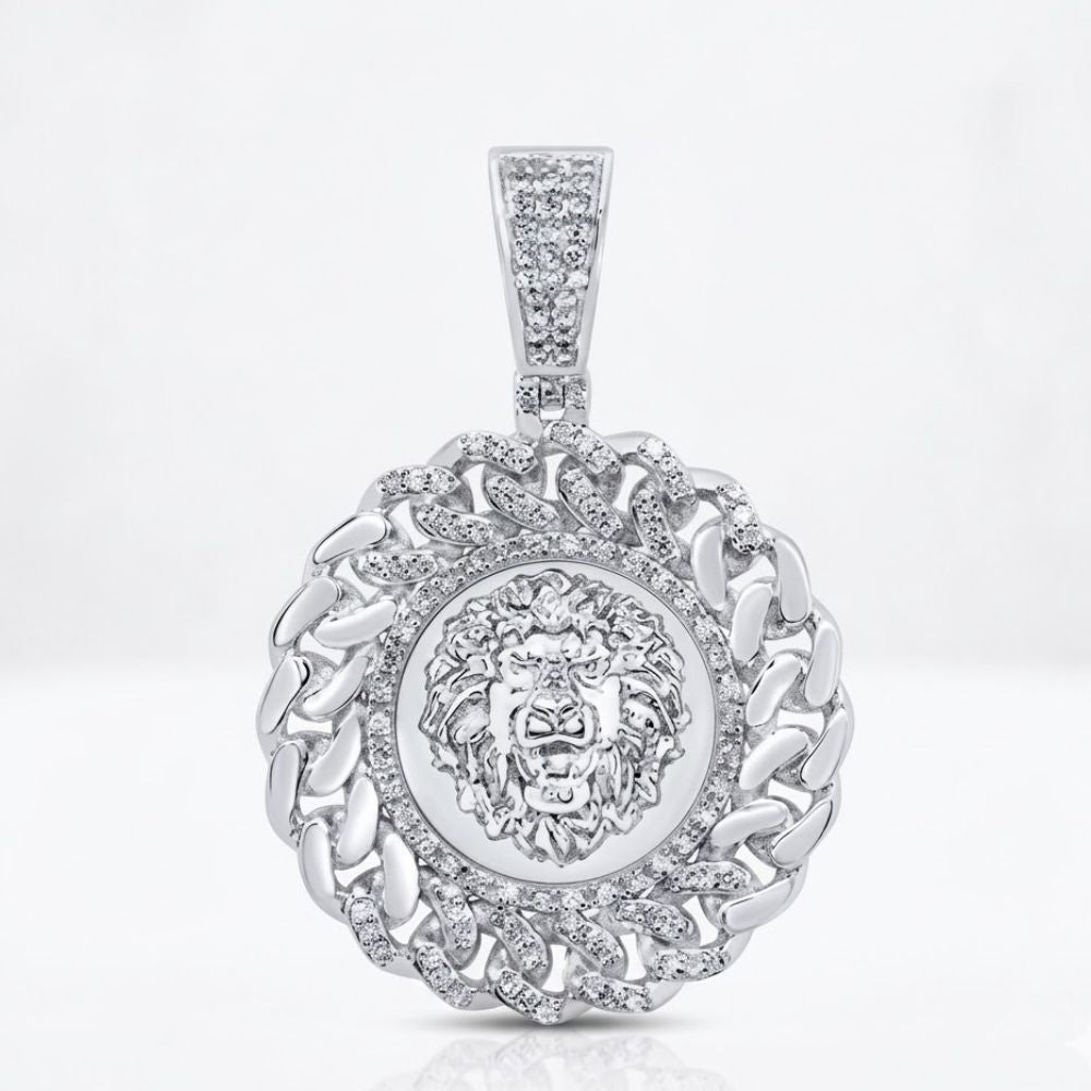 The Diamond Lion Face Cuban Charm 1/2CT Sterling Silver features a detailed lion face, interlocking diamond-studded links, and a diamond-encrusted bail for a bold pendant design.