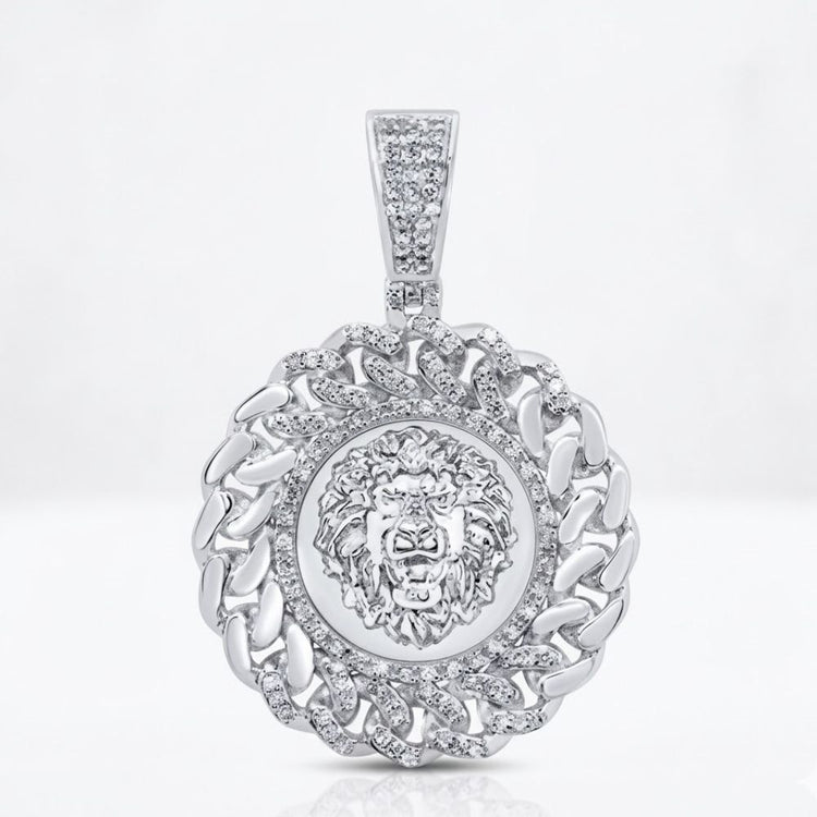 The Diamond Lion Face Cuban Charm 1/2CT Sterling Silver features a detailed lion face, interlocking diamond-studded links, and a diamond-encrusted bail for a bold pendant design.