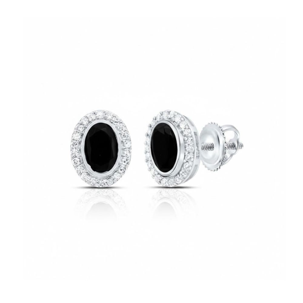A pair of 1/5CTW diamond and onyx earrings with black center stones, haloed by diamonds, set in 10k yellow and white gold.
