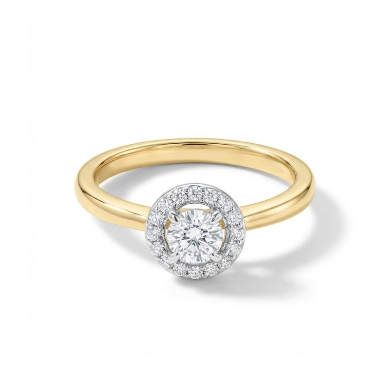 The 14k Gold Round Diamond Halo Engagement Ring features a round center diamond with a sparkling halo on a plain yellow gold band, beautifully displayed against a white background.