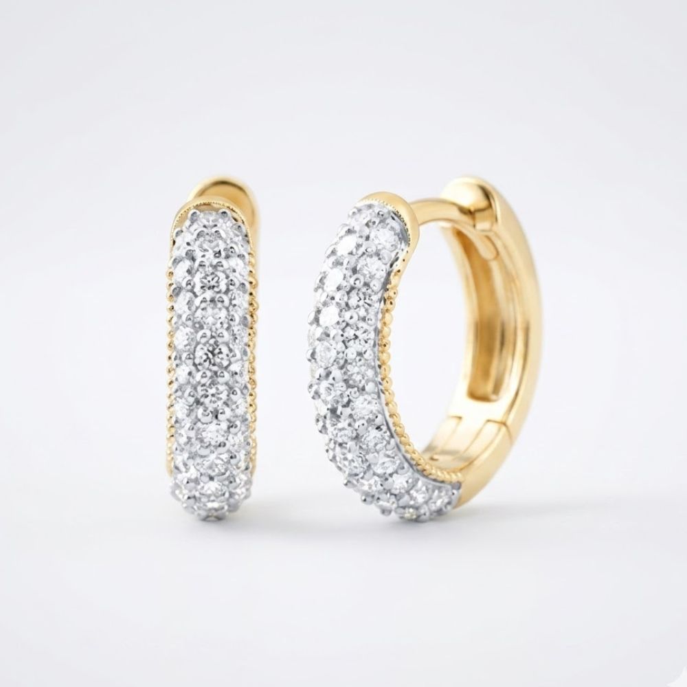 A pair of 3/4CTW natural diamond hoop earrings in 14k gold, shown on a simple light background.