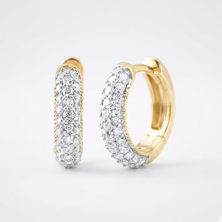 A pair of 3/4CTW natural diamond hoop earrings in 14k gold, shown on a simple light background.