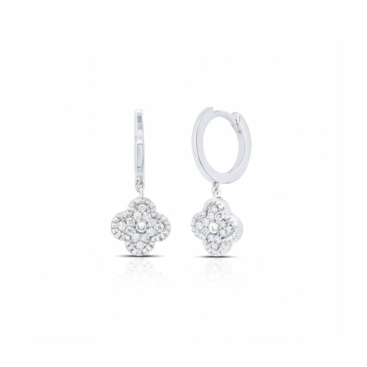The 1/6CTW Clover Diamond Dangling Earrings in 10K gold feature flower-shaped pendants adorned with sparkling diamonds, combining delicate elegance and shine, showcased against a plain white background.