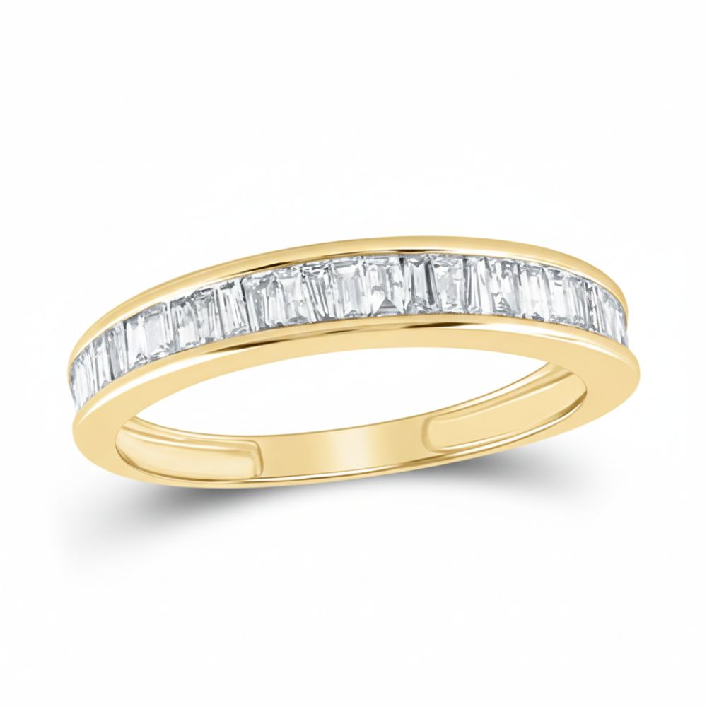 The 10k Yellow Gold Baguette Diamond Wedding Band 1/2 Cttw features a sleek row of rectangular baguette diamonds set closely together along the top for a modern look, shown on a white background.