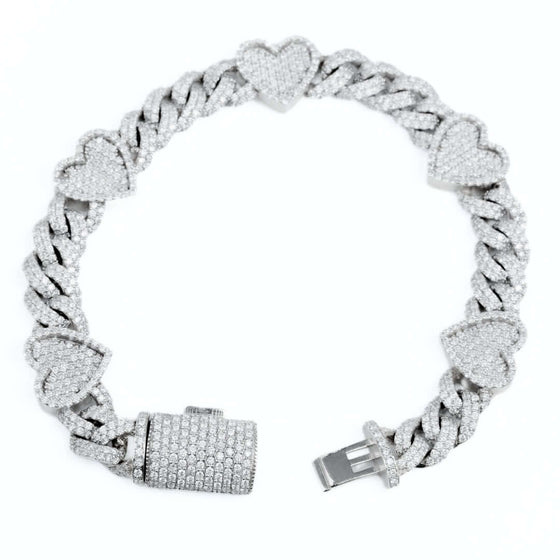 Diamond Heart Cuban Link Bracelet Dazzling 6ct diamond heart Cuban link bracelet in 10k gold. SI+ natural diamonds sparkle on this bold 7" statement piece. Shop luxurious diamond bracelets!