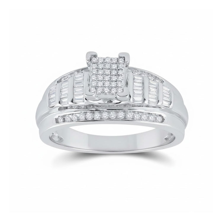 The Sterling Silver Diamond Cluster Bridal Engagement Ring showcases a rectangular diamond cluster center, baguette-cut side diamonds, and extra small diamonds along the band for added sparkle.