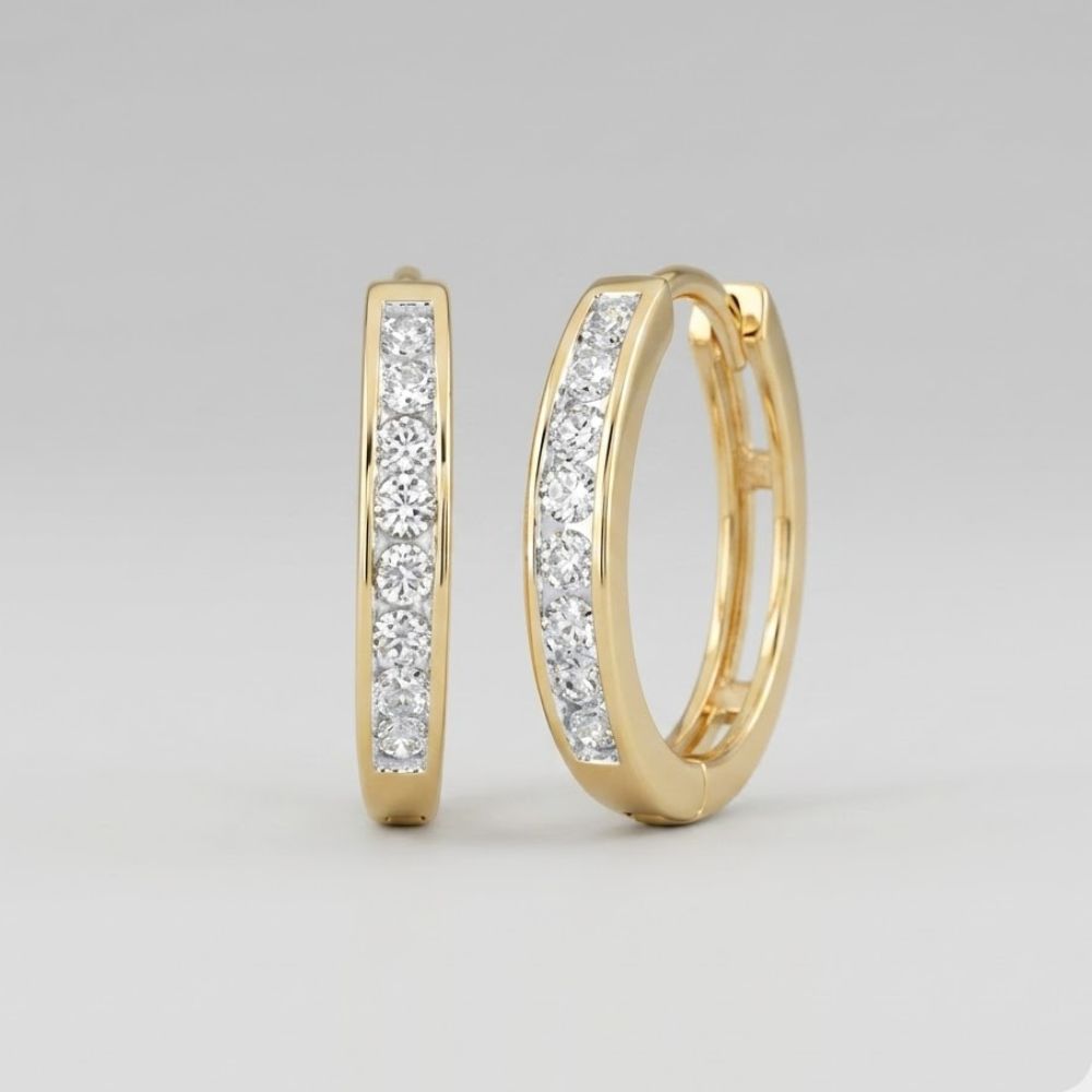 The 10K Diamond Hoop Earrings 1/4 CTTW Gold feature a row of round diamonds set along the front surface, shown against a plain light gray background.
