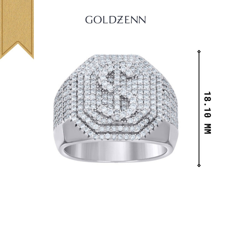 The Moissanite Octagon Head Dollar Sign Currency Ring features a sterling silver band with small stones forming a dollar sign on the front, measuring 18-10 mm, and displays "Goldzenn" above the ring.