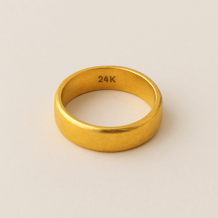 A 4mm, 24k Band Ring with “24K” engraved inside, featuring a plain polished design in a comfort-fit style, displayed on a neutral light background.