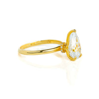 A 2.08ct pear lab diamond solitaire engagement ring in 14k yellow gold, featuring a brilliant center stone in a classic setting, shown from the side on a white background.