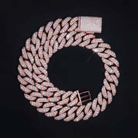 A Rose Gold Moissanite Cuban Link Chain - 20mm, encrusted with sparkling stones, is arranged in a circle on a black background with its clasp visible at the top.