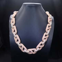 The Two Tone Moissanite Mariner Bracelet - 20mm is showcased on a black jewelry bust against a dark backdrop, highlighting the elegance of its nautical-inspired design with sparkling moissanite accents.